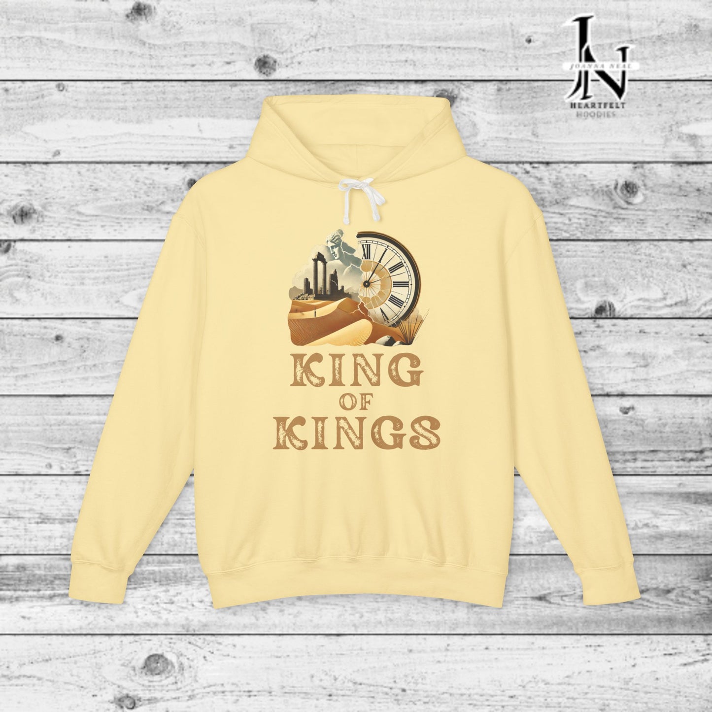 Poetry Clothing - Featuring a vivid desert sunset, a fallen statue, and the iconic quote, "Look on my works, ye mighty, and despair," this hoodie captures the impermanence of power and the beauty of art. The front features the majestic phrase "King of Kings" with a timeless design showcasing a crumbling statue, a clock symbolizing the passage of time, and desert ruins. On the back, the unforgettable quote, "Look on my works, ye mighty, and despair,