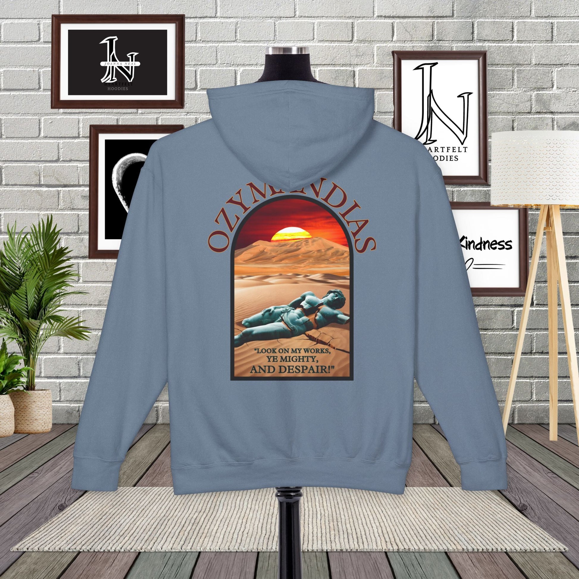 Percy Bysshe Shelley's "Ozymandias" our poetry clothing features a vivid desert sunset, a fallen statue, and the quote,  "Look on my works, ye mighty, and despair". 