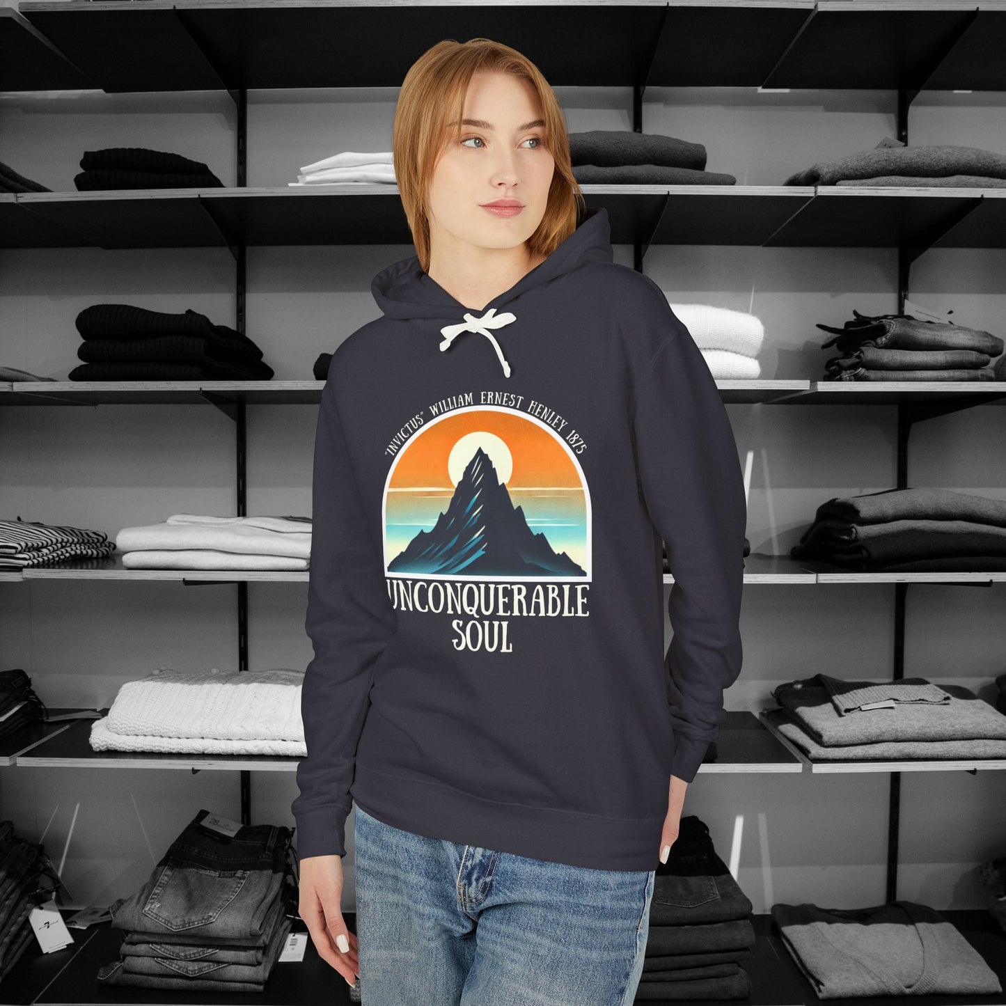 This Piece of Poetry Clothing features a bold and motivational statement: "I am the captain of my soul," paired with a stunning mountain scene under a rising sun.