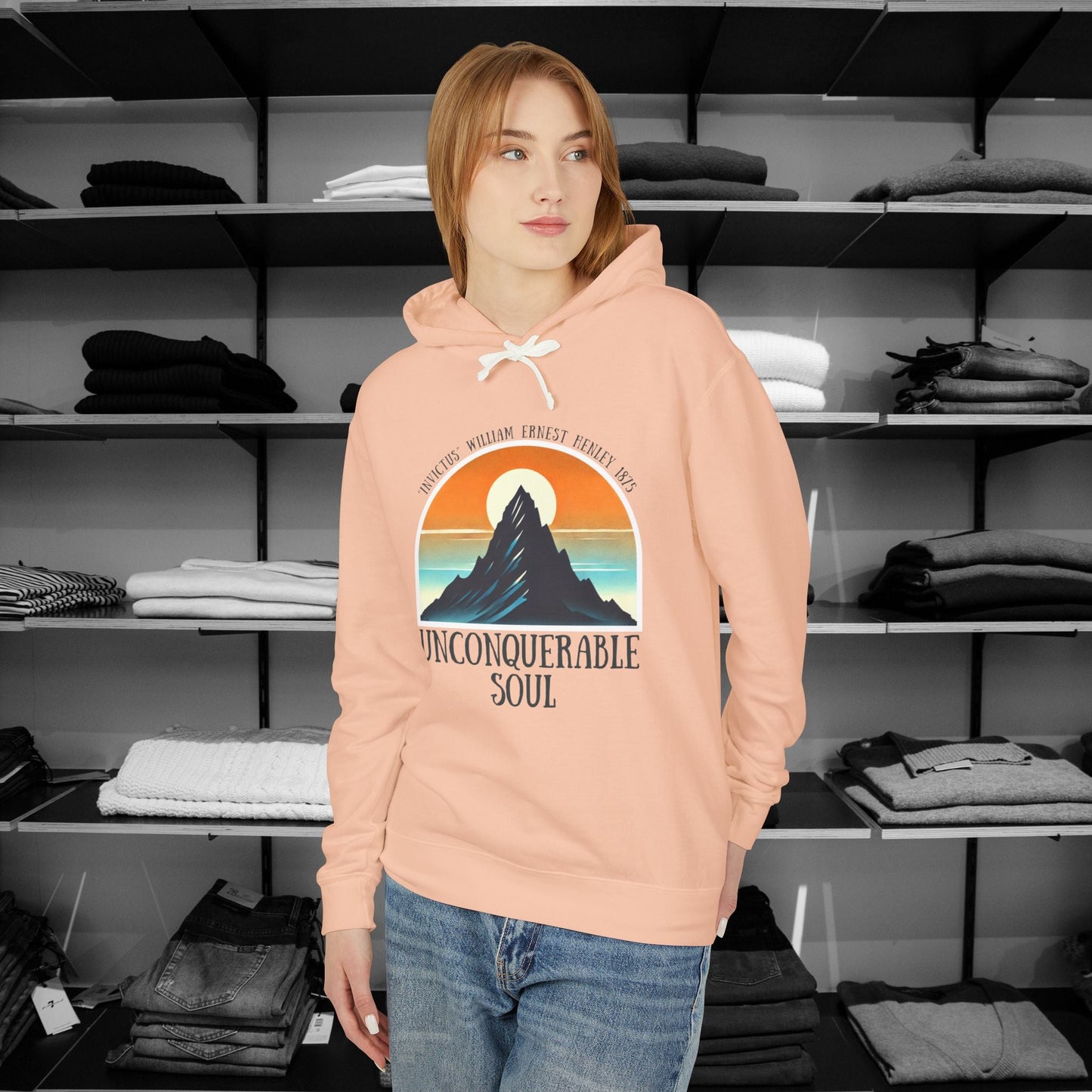 This Piece of Poetry Clothing features a bold and motivational statement: "I am the captain of my soul," paired with a stunning mountain scene under a rising sun.