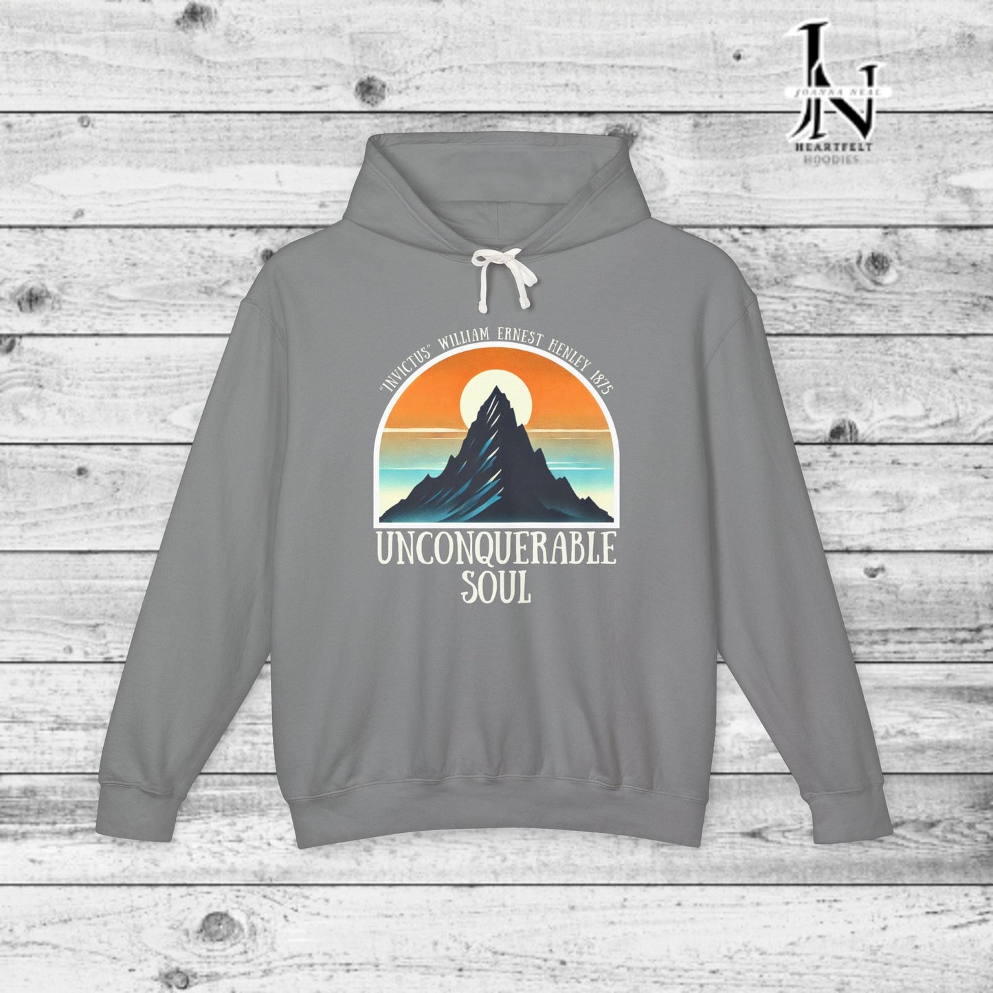 This Piece of Poetry Clothing features a bold and motivational statement: "I am the captain of my soul," paired with a stunning mountain scene under a rising sun.