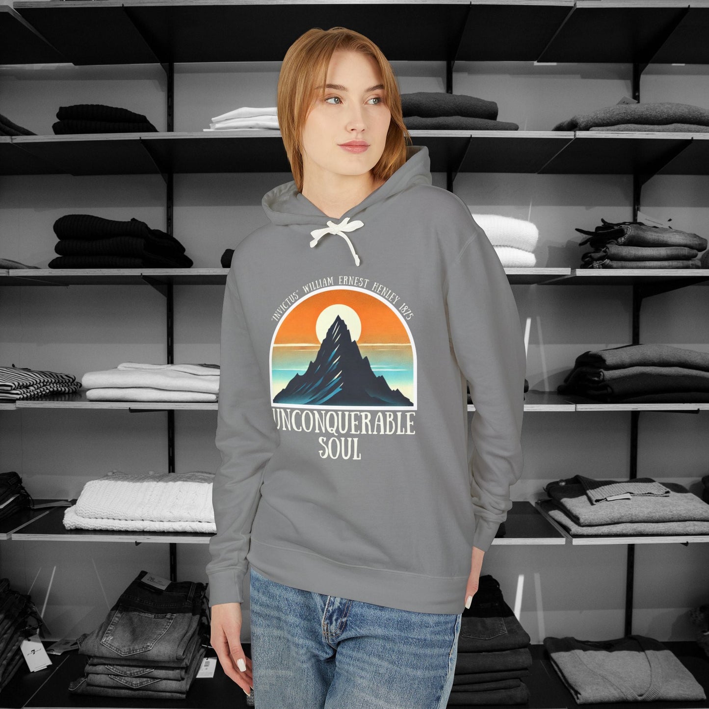 This Piece of Poetry Clothing features a bold and motivational statement: "I am the captain of my soul," paired with a stunning mountain scene under a rising sun.