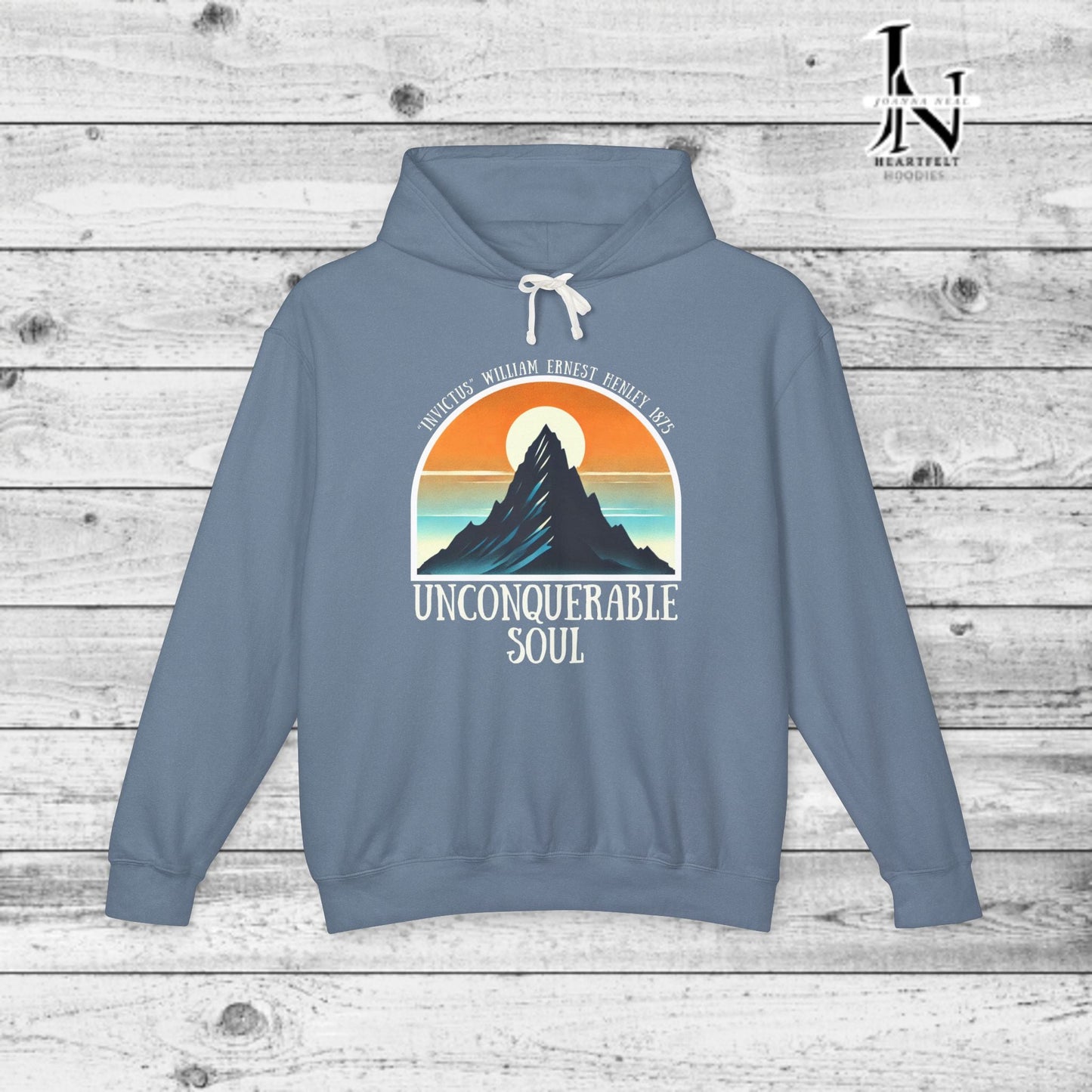 This Piece of Poetry Clothing features a bold and motivational statement: "I am the captain of my soul," paired with a stunning mountain scene under a rising sun.