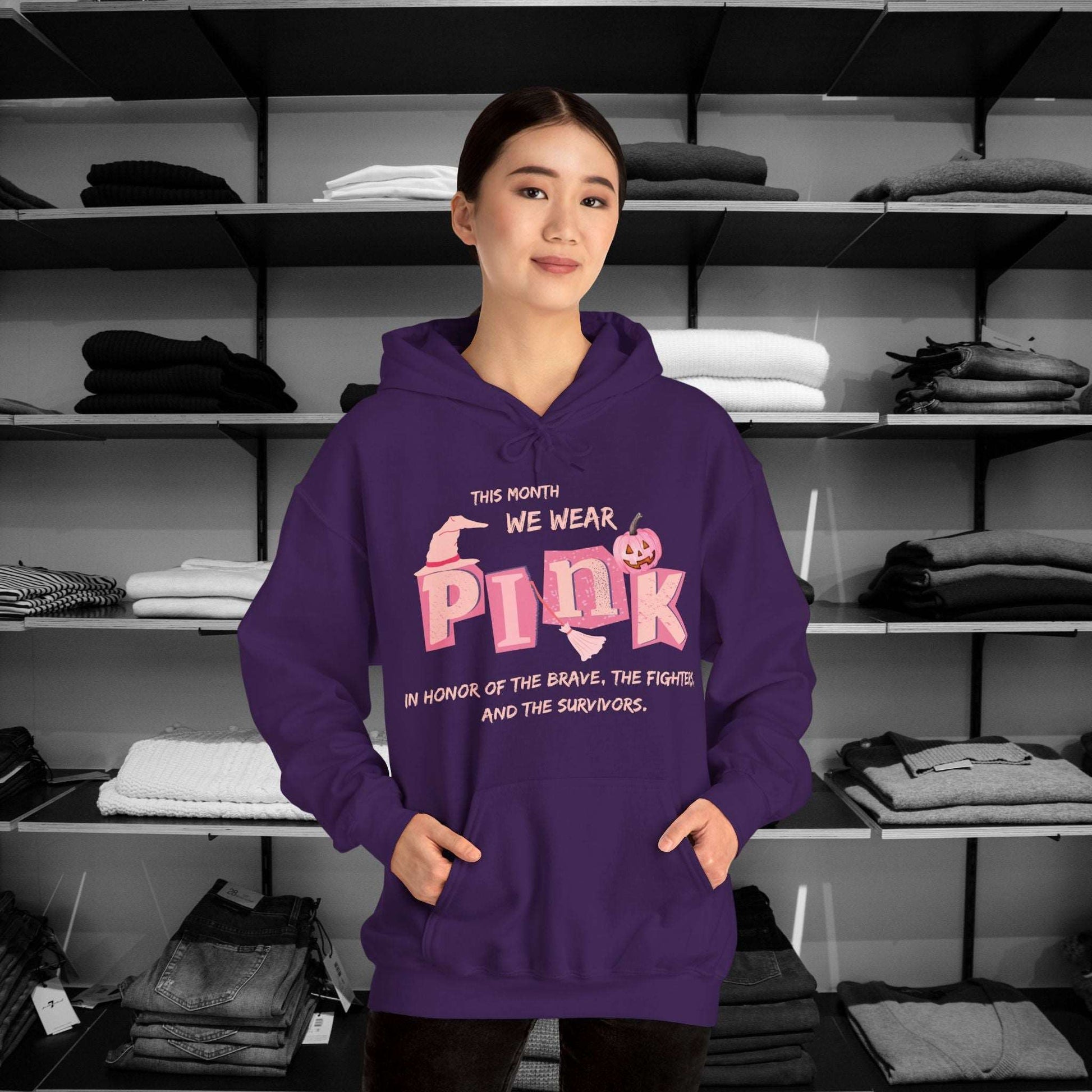 Breast Cancer Awareness Hoodie -This Month We Wear Pink. Stand strong in this empowering hoodie that speaks to both the inner and outer strength of canser sufferers.