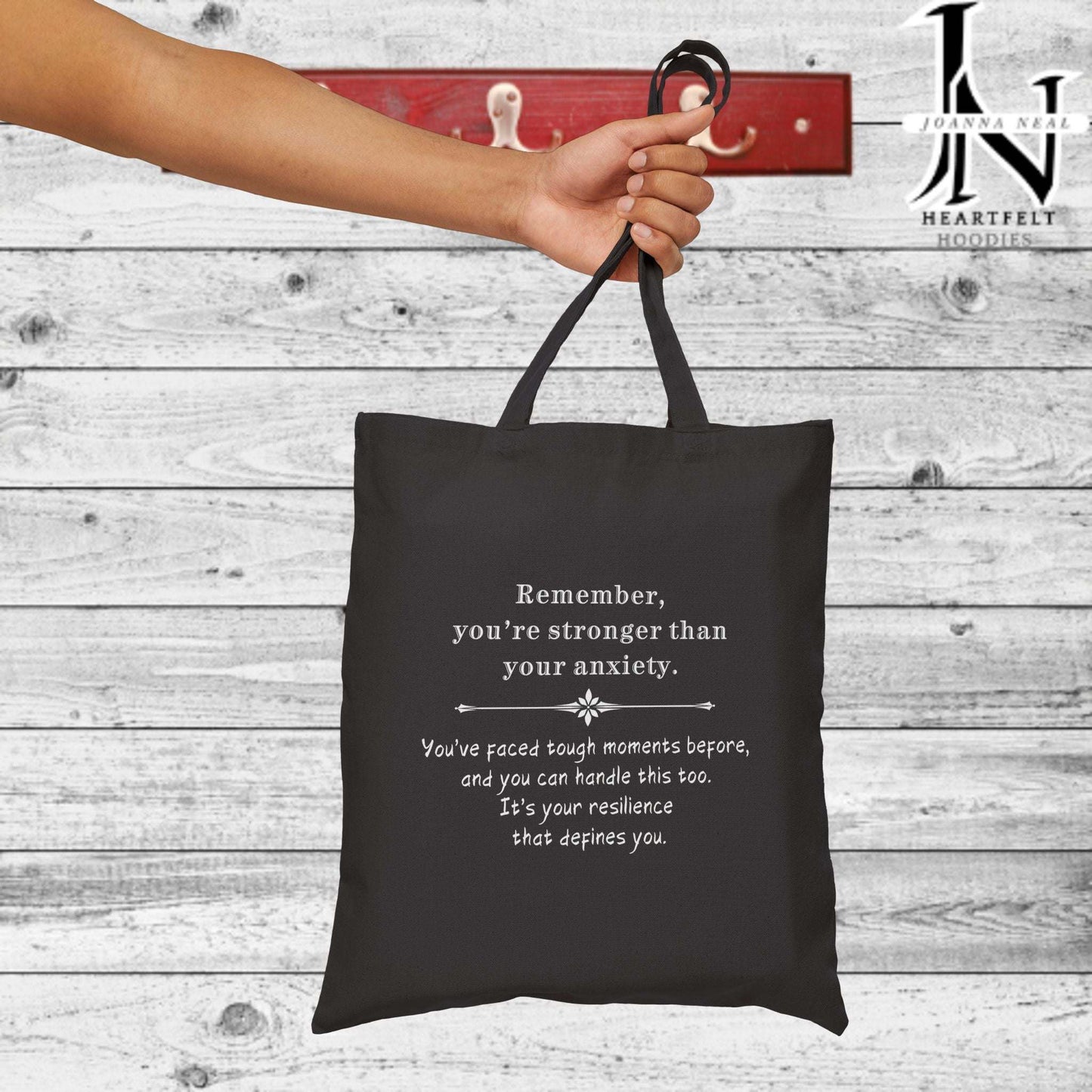 Anxiety can feel overwhelming, but a simple reminder can make all the difference. This Anxiety Cotton Canvas Tote Bag is designed to spread a message of strength and hope with the phrase, "Remember you're stronger than your anxiety