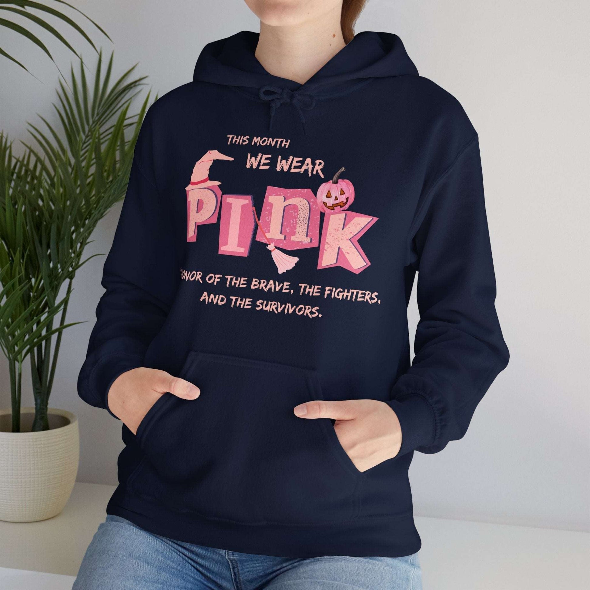 Breast Cancer Awareness Hoodie -This Month We Wear Pink. Stand strong in this empowering hoodie that speaks to both the inner and outer strength of canser sufferers.