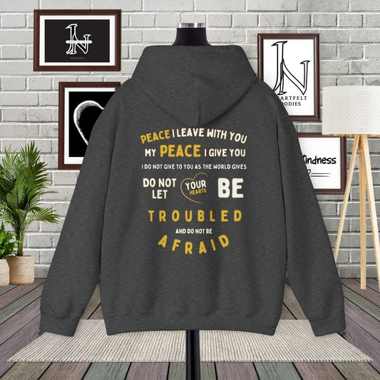 Spreading a message of peace and faith with these John 14:27 designed Christian hoodies from Heartfelt Hoodies. The front features a bold "Peace" design with a dove.