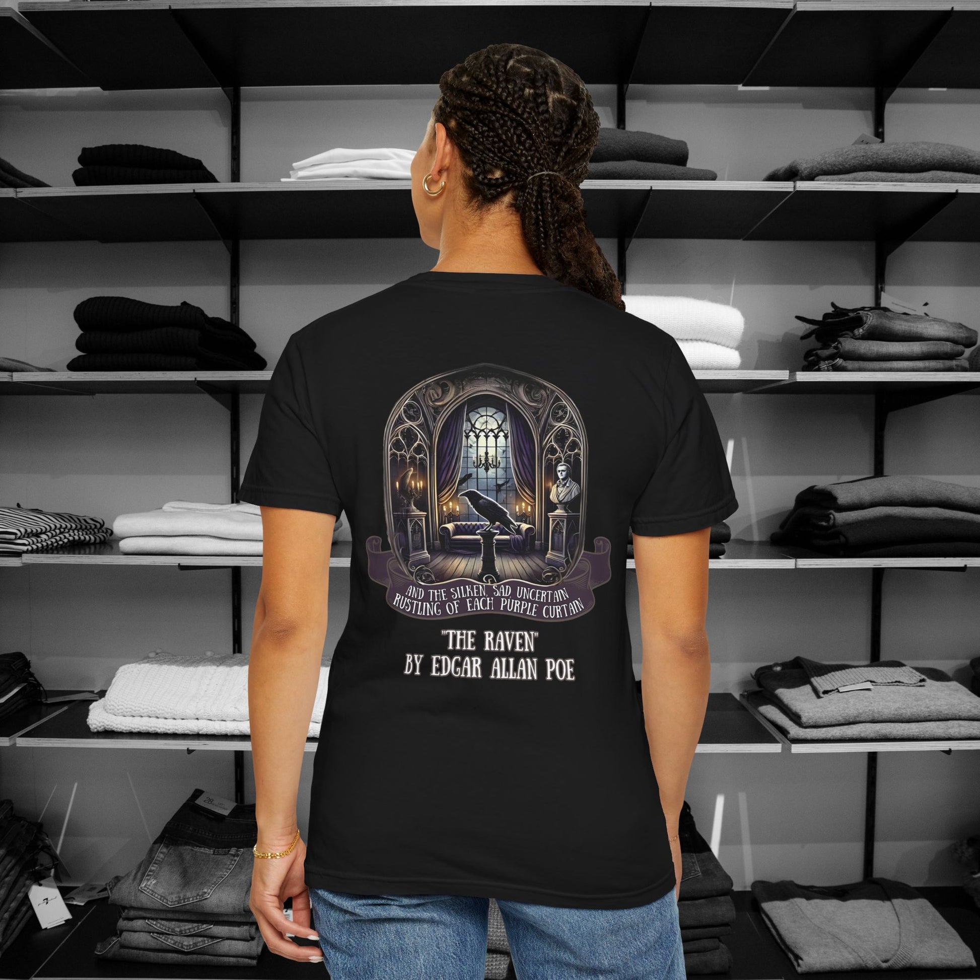 Poetry Clothing "The Raven" Featuring a mesmerizing back design of Poe’s iconic chamber, complete with a moonlit window, the bust of Pallas, and the ever-watchful raven, this "The Raven" t shirt brings literary elegance to your festive wardrobe. The ornate gothic arches and glowing candles capture the eerie yet enchanting spirit of the season. A minimalist raven silhouette on the front adds a subtle touch of mystery.