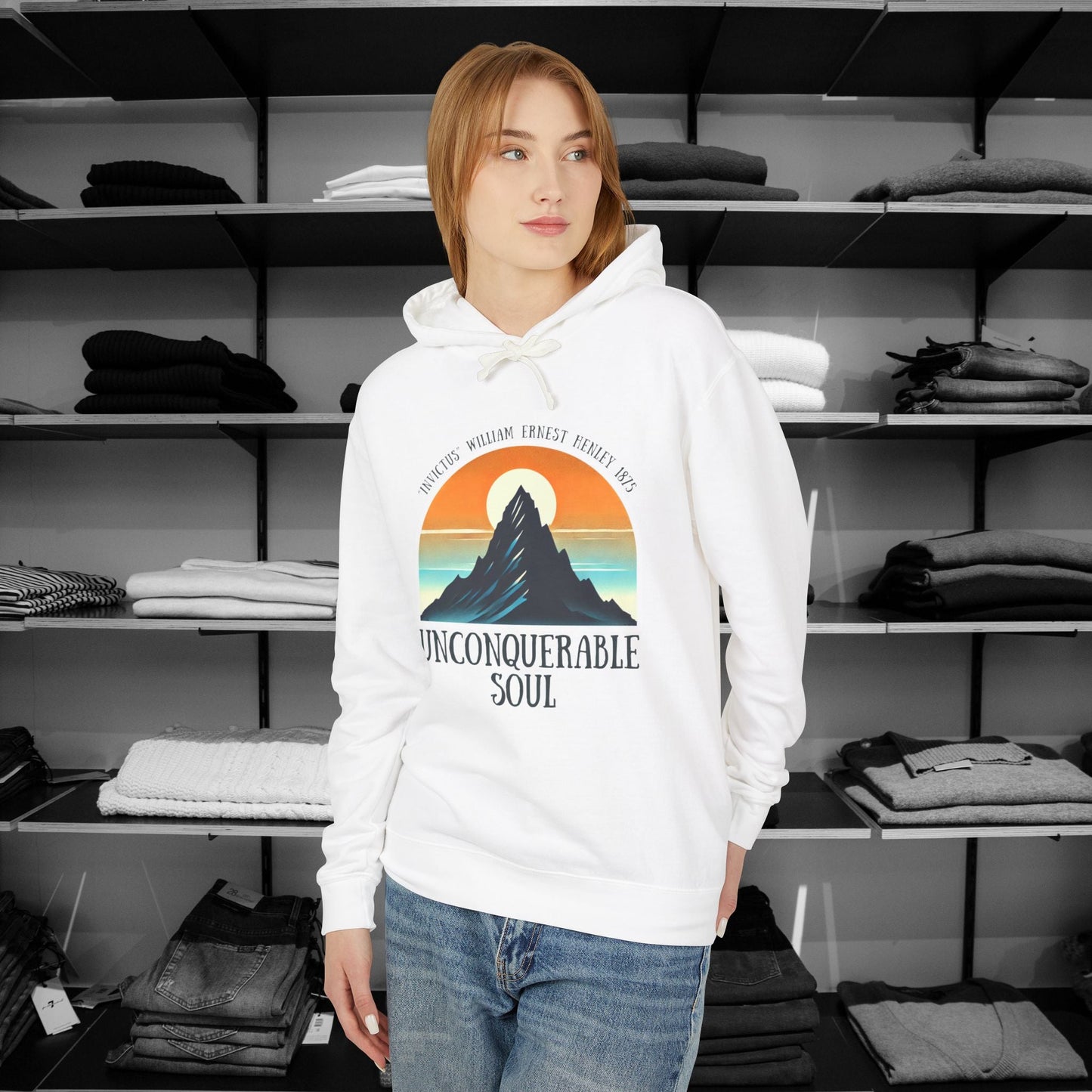 This Piece of Poetry Clothing features a bold and motivational statement: "I am the captain of my soul," paired with a stunning mountain scene under a rising sun.