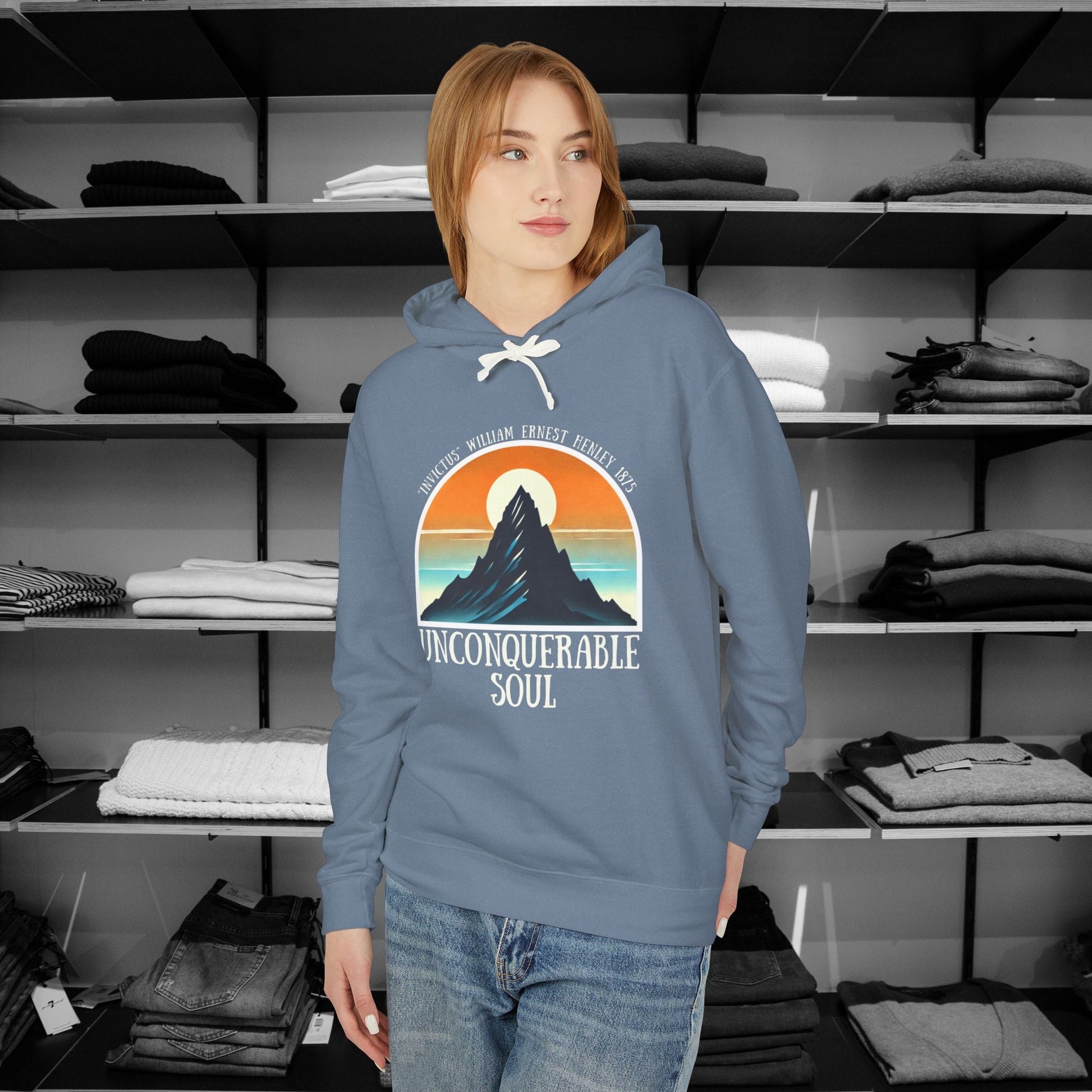 This Piece of Poetry Clothing features a bold and motivational statement: "I am the captain of my soul," paired with a stunning mountain scene under a rising sun.