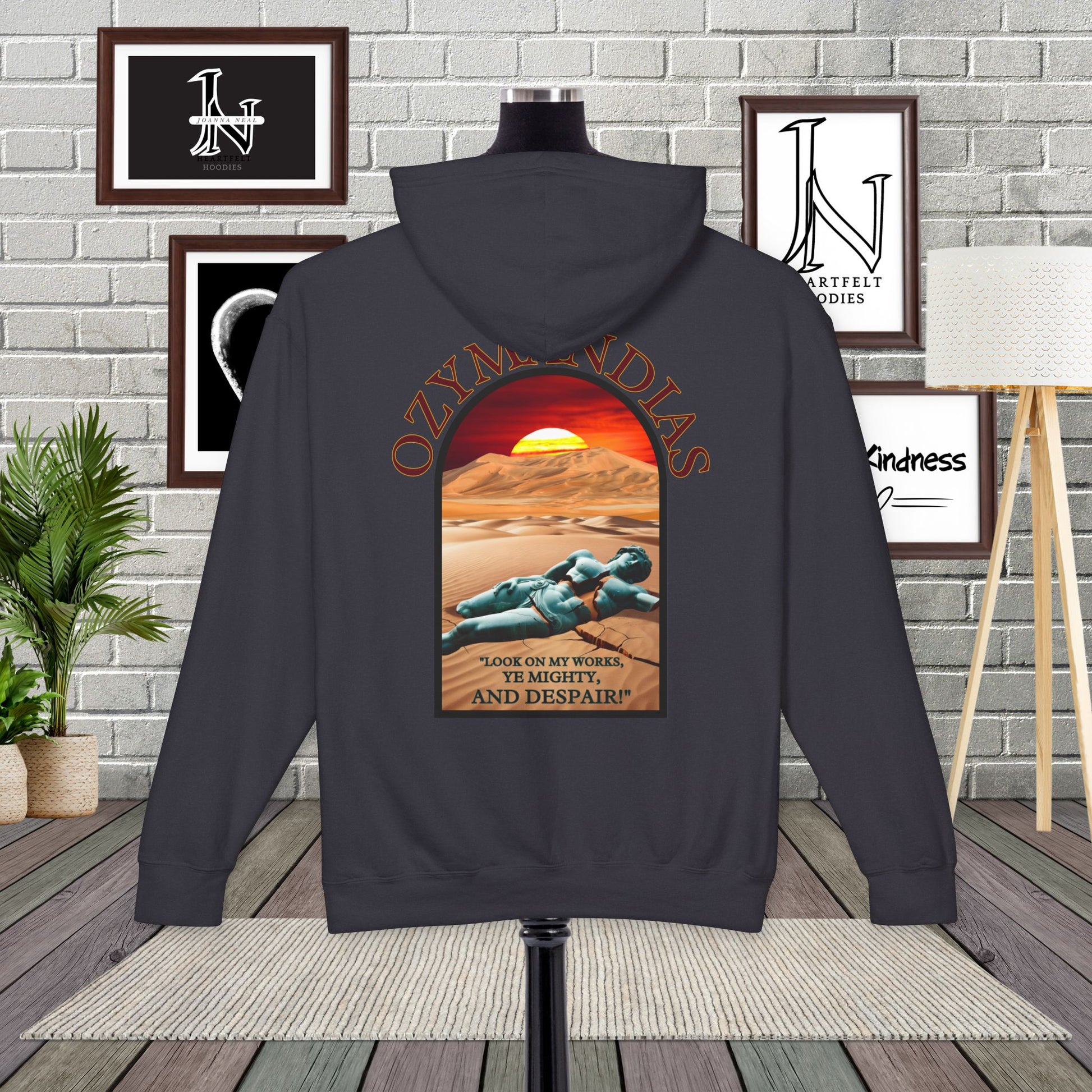 Poetry Clothing - Featuring a vivid desert sunset, a fallen statue, and the iconic quote, "Look on my works, ye mighty, and despair," this hoodie captures the impermanence of power and the beauty of art. The front features the majestic phrase "King of Kings" with a timeless design showcasing a crumbling statue, a clock symbolizing the passage of time, and desert ruins. On the back, the unforgettable quote, "Look on my works, ye mighty, and despair,