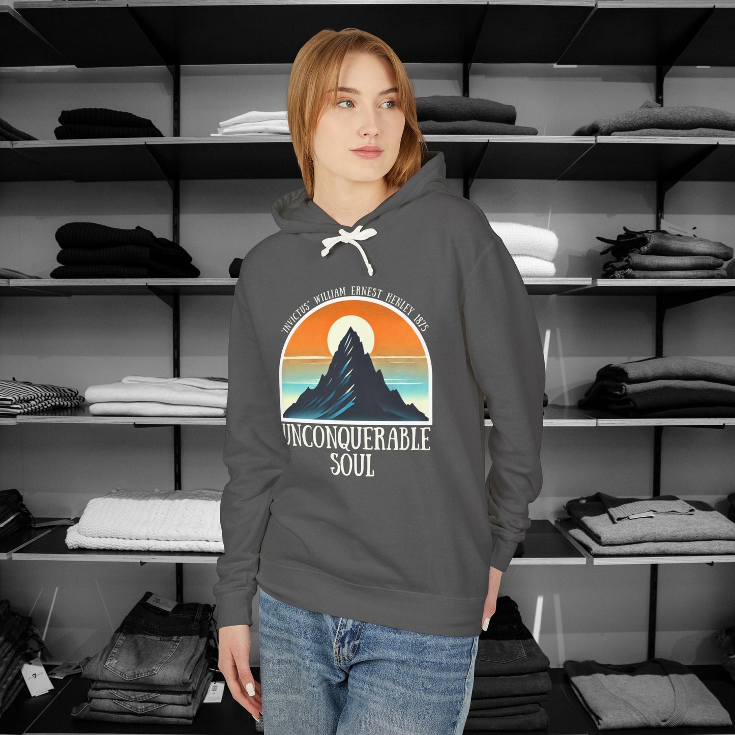 This Piece of Poetry Clothing features a bold and motivational statement: "I am the captain of my soul," paired with a stunning mountain scene under a rising sun.