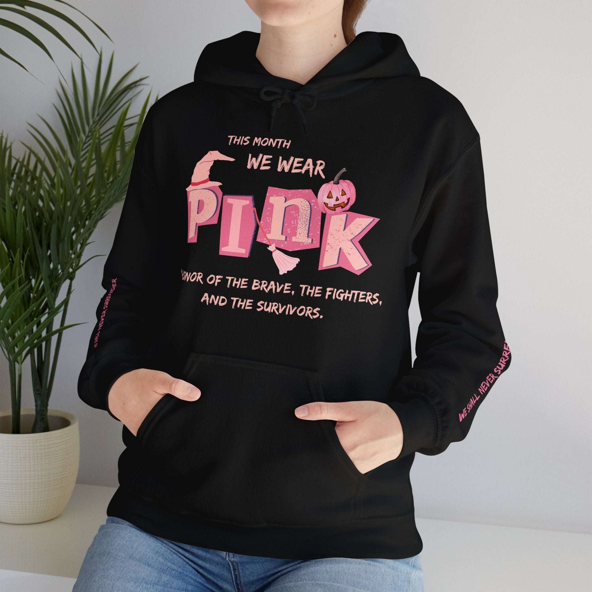 Breast Cancer Awareness Hoodie This Month We Wear Pink. In honor of the brave, the fighters, and the survivors." Placed on each lower arm is We shall never surrender